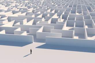 businessman looking at maze entrance
