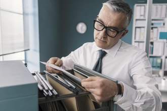 businessman searching for files and documents