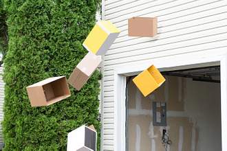 cardboard boxes being thrown out window