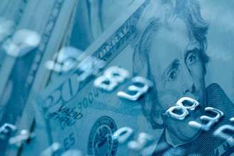 cash with an overlay of a credit card
