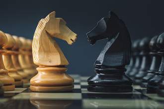 chess pieces facing each other