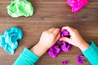 child playing with play dough