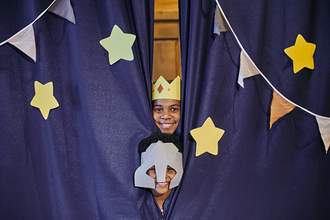 children in costumes doing a performance