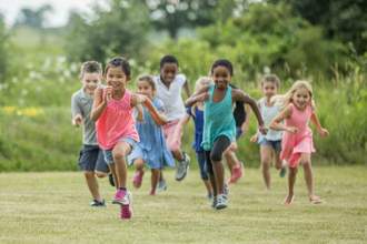 children running forward towards the audiences left hand side