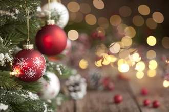 christmas tree ornaments and defocused lights background