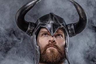close up of a man wearing an incorrect viking helmet