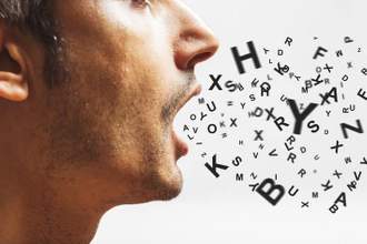 close up of a young man speaking random letters out loud