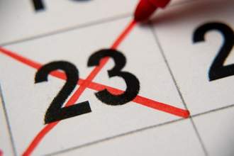 close up of the calendar date of 23rd being crossed out