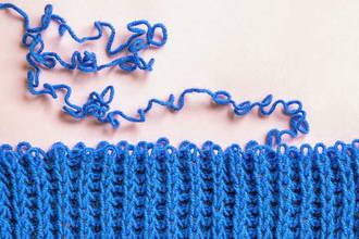 close up of yarn unraveling