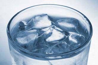 close up view of an ice cold glass of water