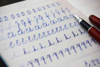 close-up of uppercase and lowercase letters written in cursive