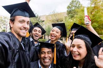 cohort group taking a graduation picture together