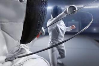 competitive fencing duel between two people