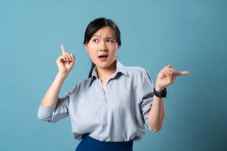 confused woman pointing in different directions