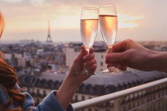 couple drinking champagne in paris