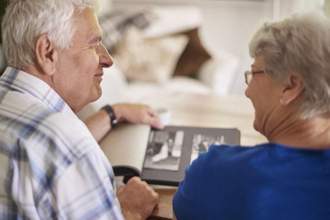 couple of elder couple reminiscing their past