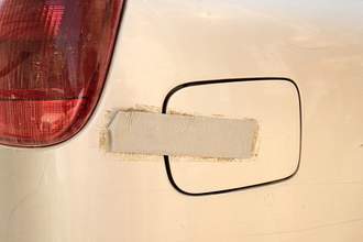 duck-tape-holding-down-gas-filler-cap