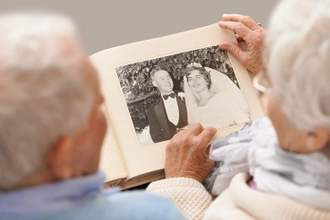 elderly couple reminiscing about their wedding