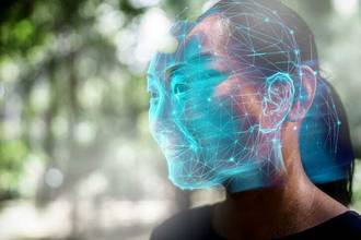 face of a woman with futuristic blue deepfake scan doubling her face