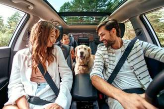 family getting ready to go on a car trip