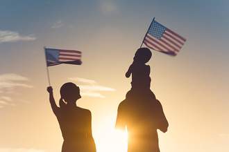 family with american flags