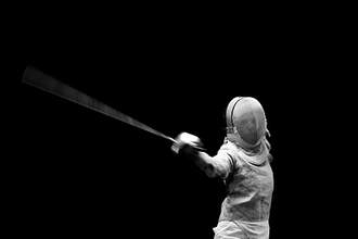fencer with sword raised