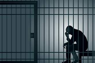 figure-of-a-man-behind-bars