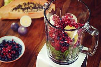 fruit mixing together in a blender