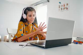 girl using computer for class