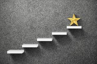 gold star on the top of the highest stair