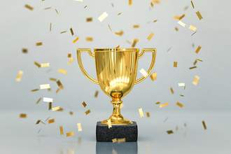 golden trophy with gold confetti flying around it
