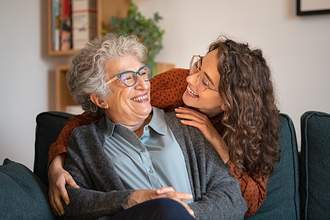 granddaughter and grandmother smiling together