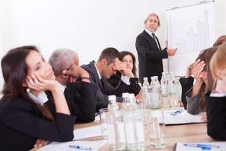 group of disappointed business colleagues listening to their boring boss