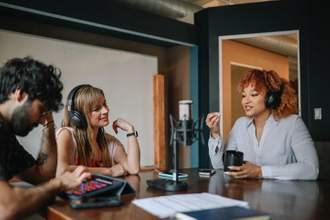 group of people having a live podcast conversation in the studio