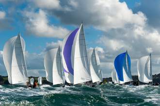 group of sailboats on water