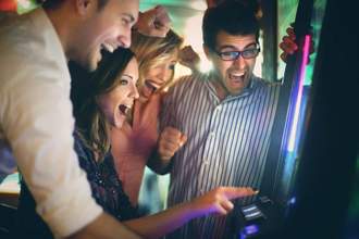 group of young adults having fun in casino