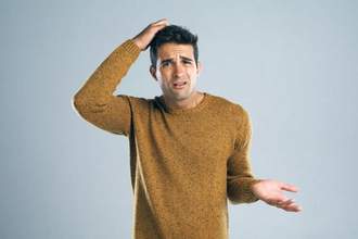 guy scratching his head looking confused