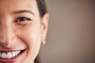 half view of a womans smiling face