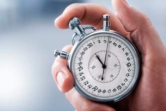 hand holding stopwatch