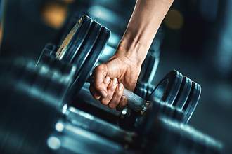 hand picking up weight