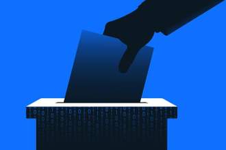 hand putting ballot paper in a box