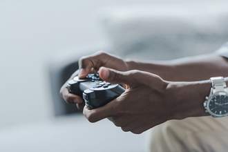 hands holding video game controller