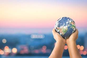hands outstretched holding the world
