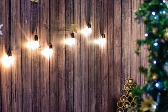 hanging lights on wooden fence