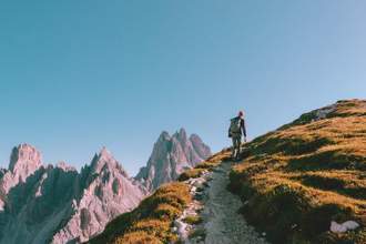 hiker making their way through the mountains