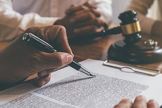 judge signs a document