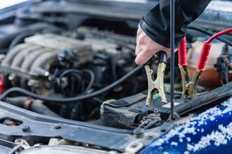 jumper cables on car engine
