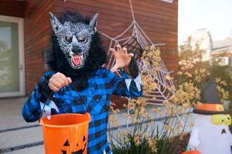 kid dressed as a werewolf while trick or treating