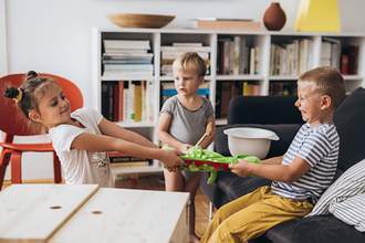 kids fight over a toy