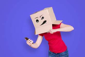 lady with an annoyed look on her box covered face wanting to punch her phone